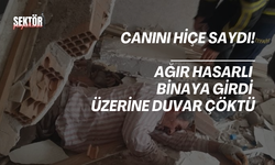 Canını hiçe sayarak ağır hasarlı binaya giren şahsın üzerine duvar çöktü