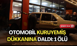 Otomobilin kuruyemiş dükkanına girdiği anlar güvenlik kamerasına yansıdı