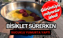 Bisiklet sürerken sucuklu yumurta yaptı, o görüntüler milyonlarca izlendi