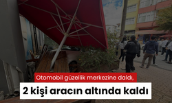 Otomobil güzellik merkezine daldı, 2 kişi aracın altında kaldı