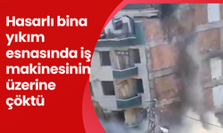 Hasarlı bina yıkım esnasında iş makinesinin üzerine çöktü