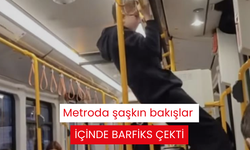 Metroda şaşkın bakışlar içinde barfiks çekti