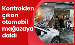 Kontrolden çıkan otomobil mağazaya daldı