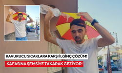 Kavurucu sıcaklara karşı İlginç çözüm: Kafasına şemsiye takarak geziyor!