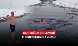 Kar, soğuk dinlemedi: 13 derecelik suda yüzdü
