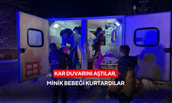 Kar duvarını aştılar, minik bebeği kurtardılar