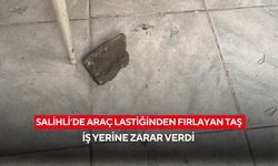 Salihli’de araç lastiğinden fırlayan taş iş yerine zarar verdi
