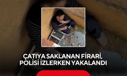 Çatıya saklanan firari, polisi izlerken yakalandı