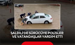 Salihli’de selde mahsur kalan sürücüye polisler ve vatandaşlar yardım etti