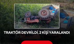 Traktör devrildi, 2 kişi yaralandı