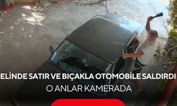 Kadının otomobiline satır ve bıçakla saldırdı! O anlar kamerada...