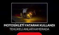 Motosikleti yatarak kullandı, tehlikeli anlar kamerada