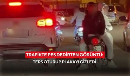 Trafikte pes dedirten görüntü: Ters oturup plakayı gizledi