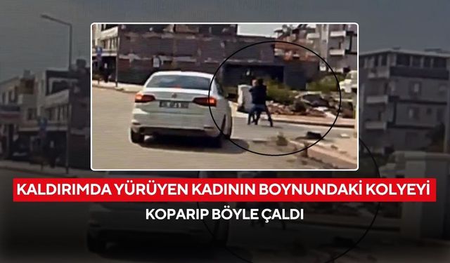 Kaldırımda yürüyen kadının boynundaki kolyeyi koparıp çalan hırsız araç kamerasına yansıdı...