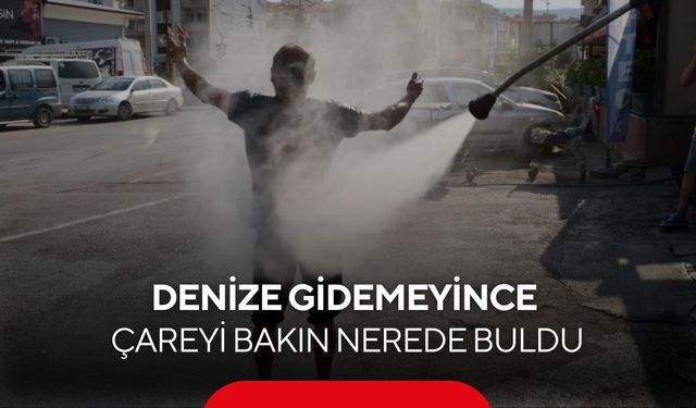Denize gidemeyince çareyi oto yıkamacıda buldu! Tazyikli suyla serinledi